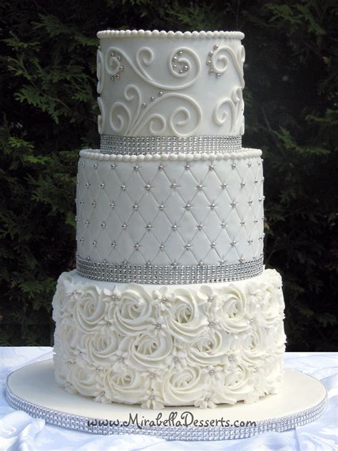 3 Tier All White Wedding Cake Decorated With Buttercream Rosettes
