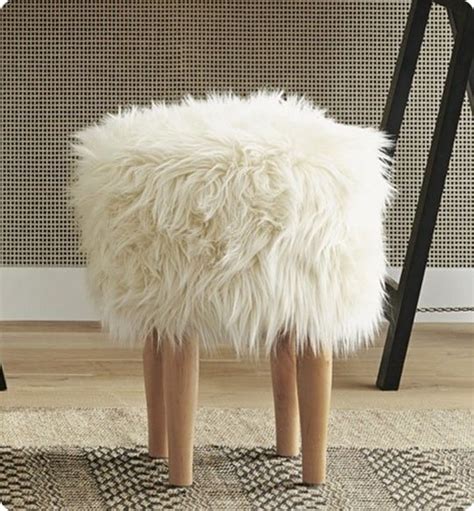Simply fold up the legs when not needed to make for simple storage. Wal-mart Find to Designer Fur Stool - KnockOffDecor.com