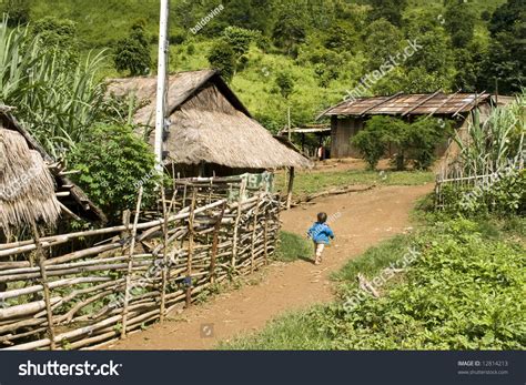 hmong-hill-tribe-village-in-northern-laos-typical-poor-village-and-thatched-huts-stock-photo