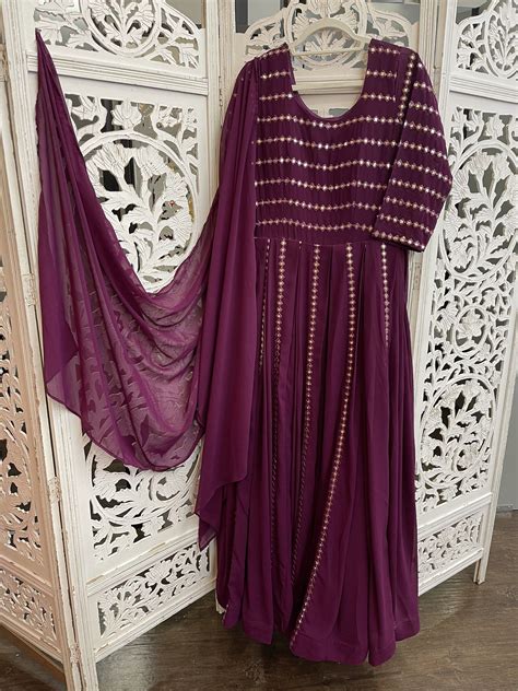 purple anarkali with mylar mirror work embroidery paired with matching dupatta material