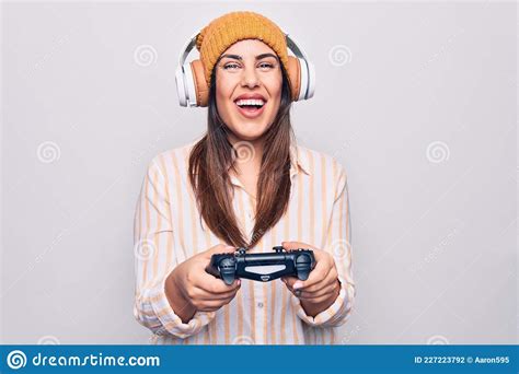 Young Beautiful Brunette Gamer Woman Playing Video Game Using Joystick