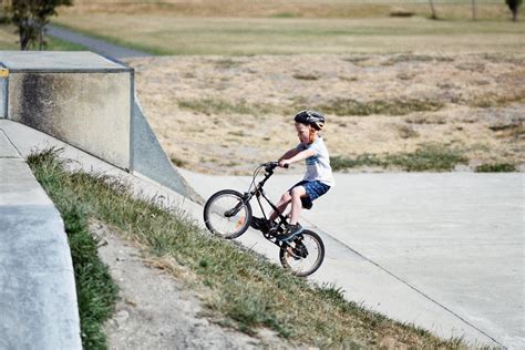 Free Photo Little Boy Ride His Bike Uphill