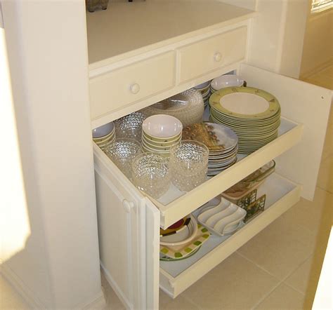 Explore tips for updating your kitchen. Appliance garages, pull-out shelves help organize kitchen ...