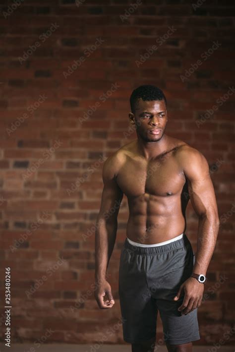 Strong Afroamerican Athletic Man With Naked Perfect Shape Muscular Body Looking At Camera