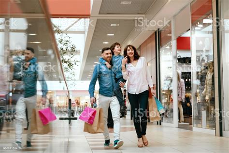 The curve is a shopping mall in mutiara damansara, petaling jaya, selangor, malaysia. Family Shopping Happy People In Mall Stock Photo ...