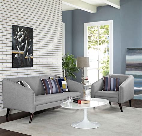 Slim arms accented with a piping trim showcase a modern look, while deep seat cushions and high back cushions provide a comfortable seating experience. Slide Light Gray 2 Piece Living Room Set from Renegade | Coleman Furniture