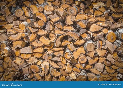 Chopped And Stacked Pile Of Pine And Birch Wood Texture Background