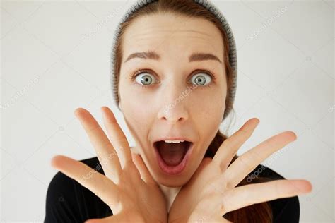 Portrait Of Student Girl Looking And Screaming In Surprise Mouth Wide