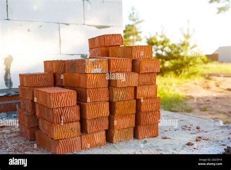 A Stack Of Red Bricks At A Construction Site Construction Materials