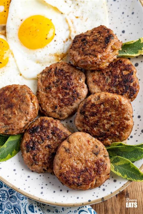Eggs And Sausage Patties On A Plate With Bay Leaf Garnish Ready To Be