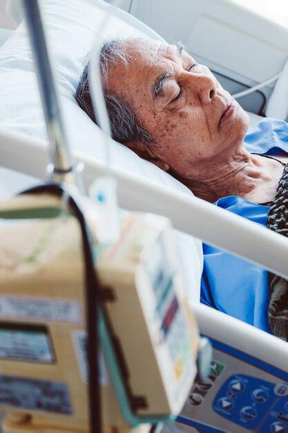 Premium Photo Senior Man Lying Down In Bed At Hospital