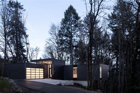 Black Wood And Glass Volumes Stagger Down Oregon Woodland To Form Roya