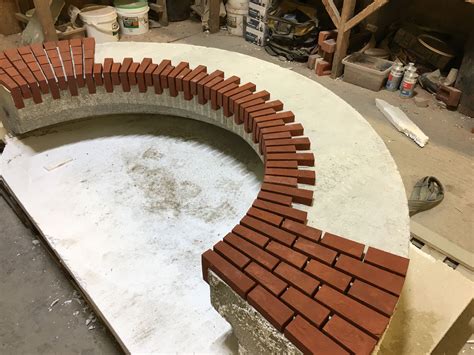 A Brick Wall Is Being Constructed Into A Circle