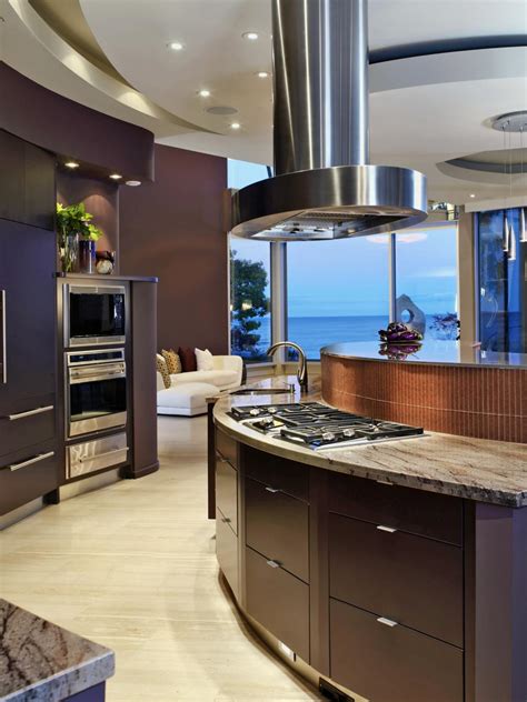 25 cherry wood kitchens (cabinet designs & ideas) share. Modern Kitchen With Curving Dark Wood Cabinets | HGTV