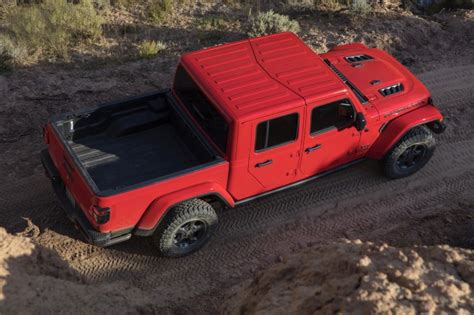 Camp in style and comfort with adventure trailers' even so, it can support 600 lbs of tools and people on its shell, with its roof strut supporting another 100. New Jeep Gladiator Pickup Truck Revealed at LA Auto Show | Truck Camper Adventure