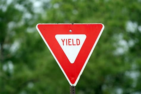 Yield Sign Pictures Images And Stock Photos Istock