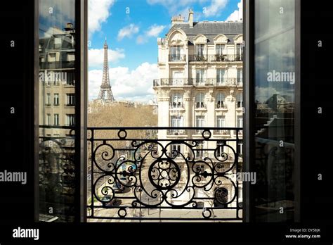 The Eiffel Tower Paris France Viewed Through An Open Window Stock
