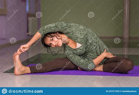 Yoga Master Stretches Yoga Poses In Fitness Class Stock Image Image