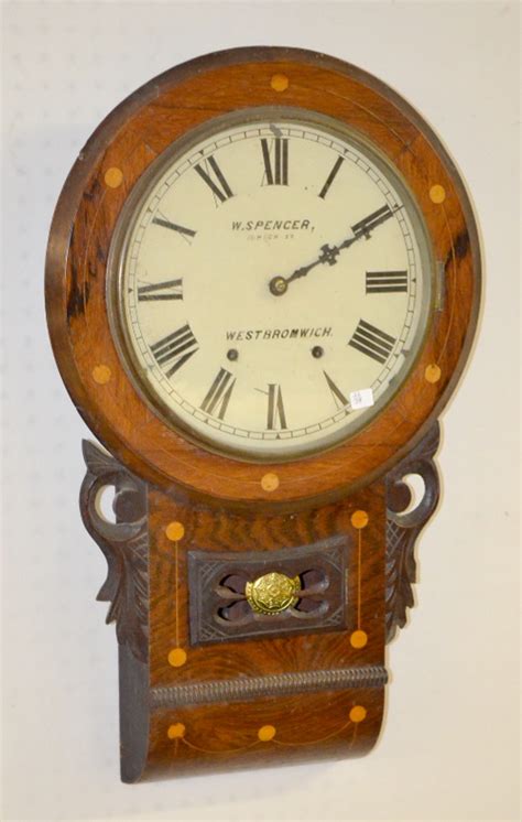 The house with a clock in its walls. Antique English Inlaid Scroll Wall Clock: T&S with a metal d