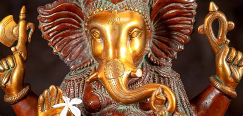 Seated Brass Ganesh Statue With Large Ruffled Ears And Cobra In Curled