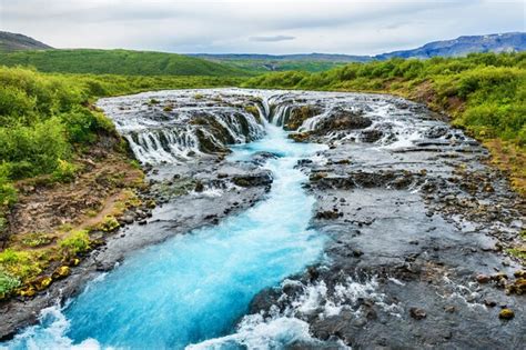 Premium Photo Bruarfoss Waterfall With Blue Water South Iceland
