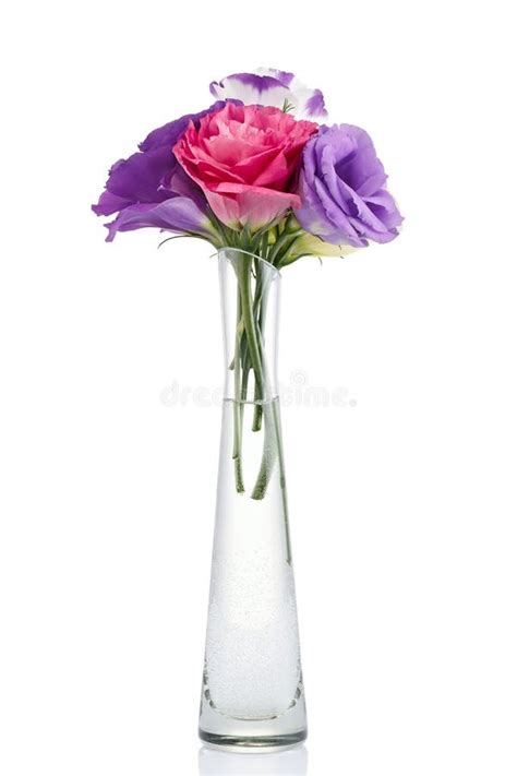 Bouquet Of Colorful Eustoma Flowers In A Glass Vase Isolated On White
