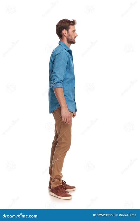 Side View Of A Young Casual Man Standing Stock Photo Image Of Hold