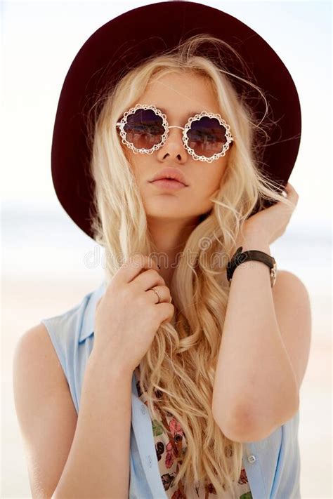 Closeup Front Portrait Of A Girl With Blonde Hair Wear Round Eyeglasses
