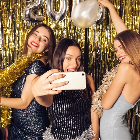 Free Photo Three Happy Girls Taking Selfie On New Year Celebration