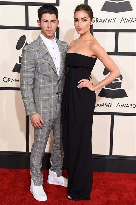 Nick Jonas And Olivia Culpo Walk The Red Carpet At The 57th Annual