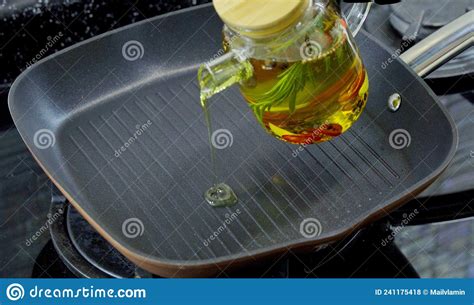 Pour Olive Oil Into A Frying Pan Stock Photo Image Of Dish Lighting