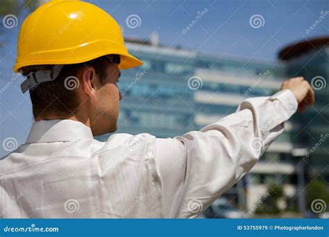 Architect In Hardhat Pointing At Construction Site Stock Image Image