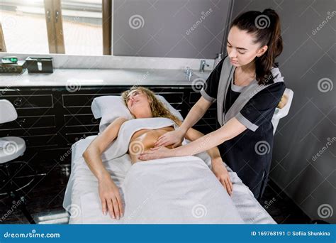 Beautiful Young Woman Having Belly Massage In Modern Medical And Cosmetology Center Pretty