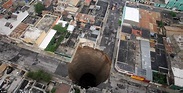 Guatemala sink hole: Tropical storm Agatha blows a 200ft hole in city ...