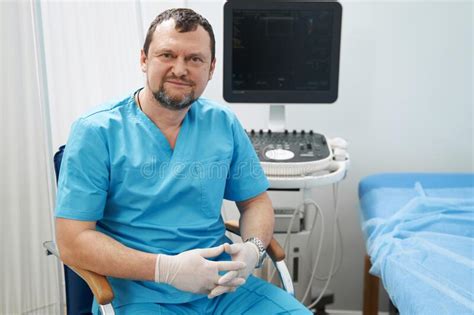 Smiling Ultrasound Specialist Sitting In His Office Stock Image Image