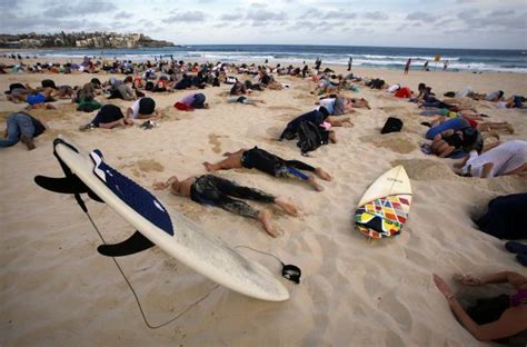 Australians Bury Heads In Sand To Mock Government Climate Stance