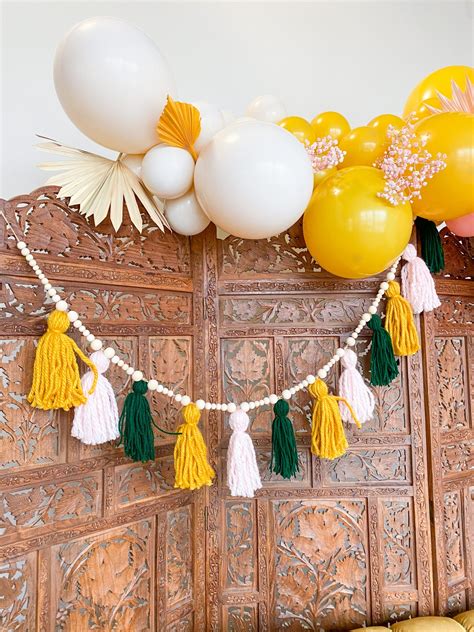 A Colorful Boho Christmas Party With A Diy Game Oh How Charming By