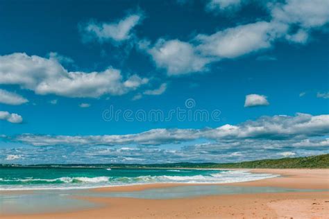 Beautiful Ocean Beach On Bright Sunny Day With White Fluffy Clouds