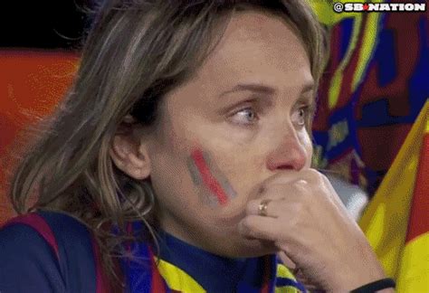 A barca fan outside the gates of camp nou crying while holding a messi jersey. Barcelona fans are very sad about their loss today ...