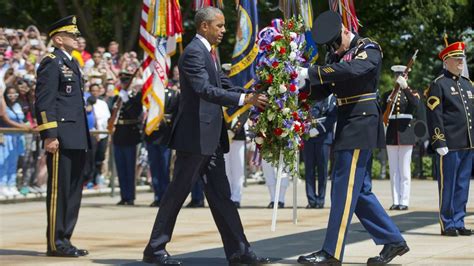President Obama Honors Fallen Troops At Arlington National Cemetery
