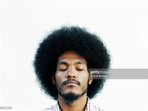 Man With Afro Hairstyle Eyes Closed Chin Up High Res Stock Photo