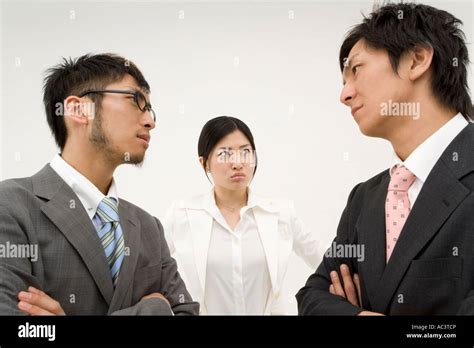 Three Business People Glaring At Each Other Stock Photo Alamy
