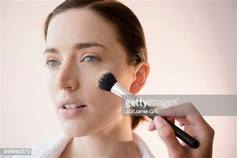 Woman Having Makeup Applied By Stylist Photo Getty Images