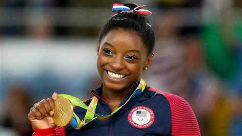 Simone biles is the most decorated american gymnast, with more than two dozen olympic and world championship medals to her name. Simone Biles Selected as Team USA Flag Bearer For Rio ...