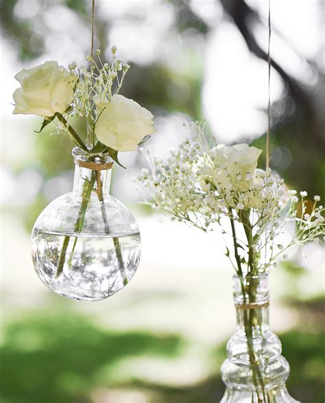 There's no shortage of ways to add personal touches to your day to celebrate your love with friends and family. DIY Hanging Flower Vases for Backyard Weddings - Beacon ...
