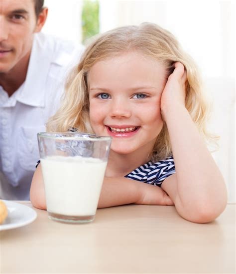 Premium Photo Smiling Little Girl Drinking Milk