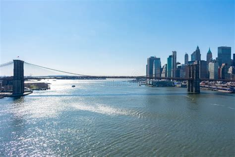 The Brooklyn Bridge And The Lower Manhattan New York City Skyline Along