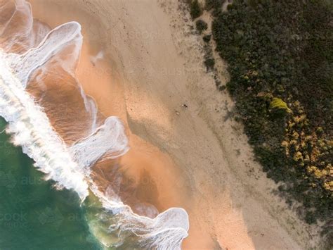Image Of Aerial View Of Breaking Wave Washing On A Sandy Beach