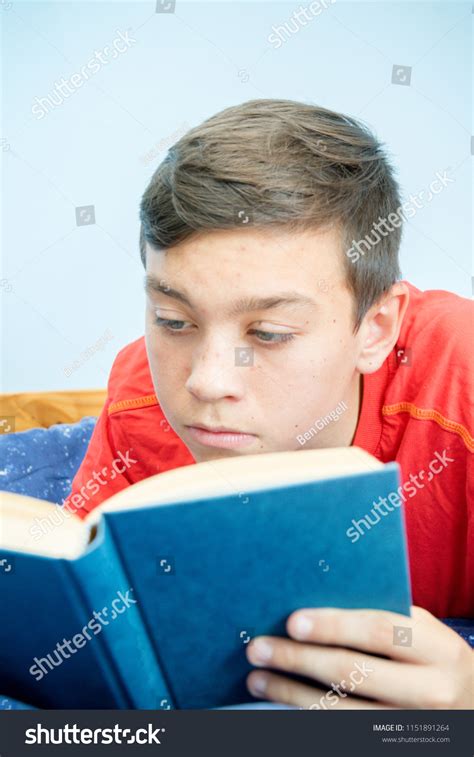 Caucasian Teenage Boy Reading Book Laying Stock Photo Edit Now 1151891264