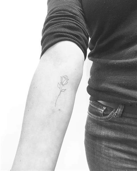 Fine Line Rose Tattoo On The Inner Forearm